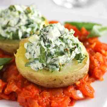 Spinach and ricotta stuffed potatoes with tomato sauce