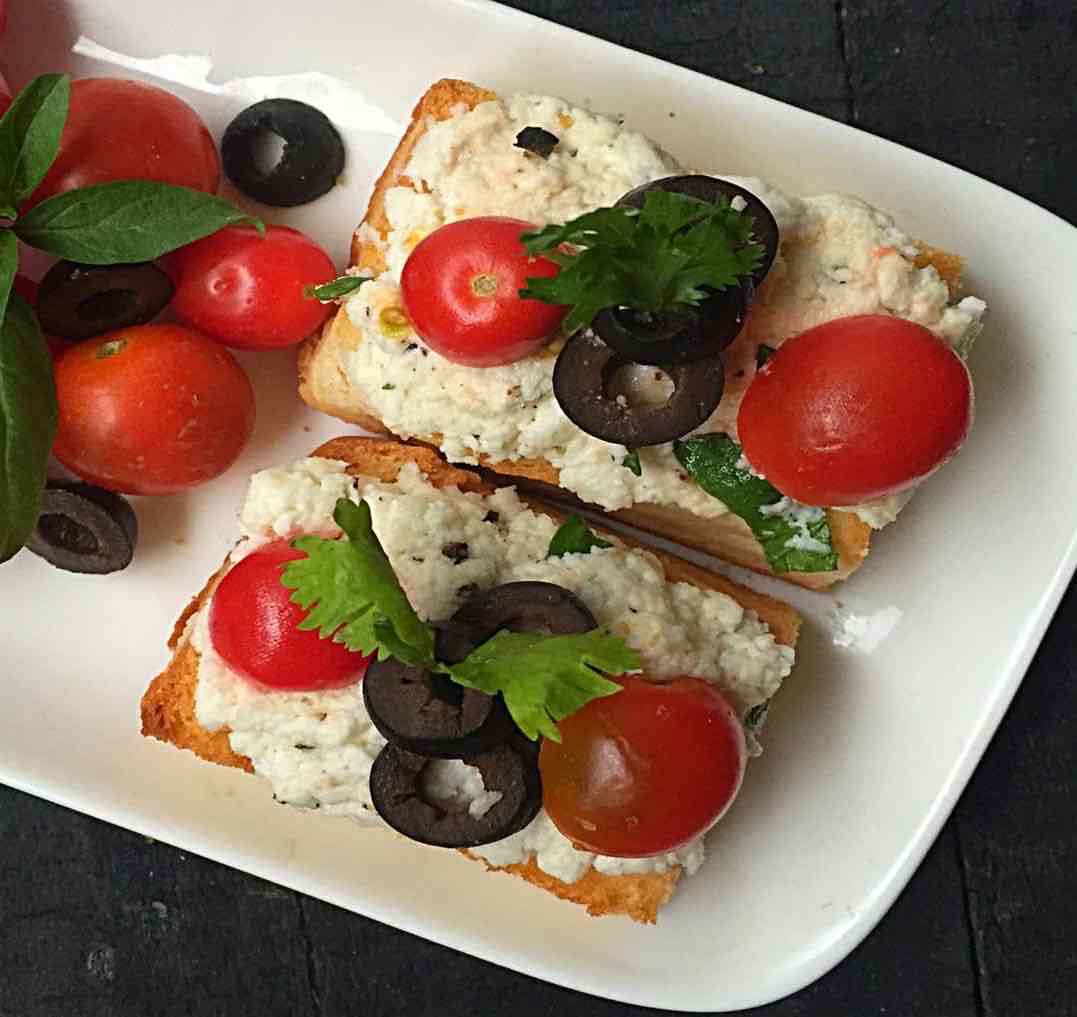 Italian Ricotta Crostini with Olives and Cherry Tomatoes Recipe